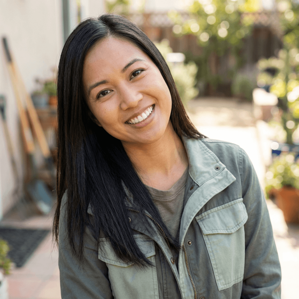 A woman with a warm smile in a bright community room